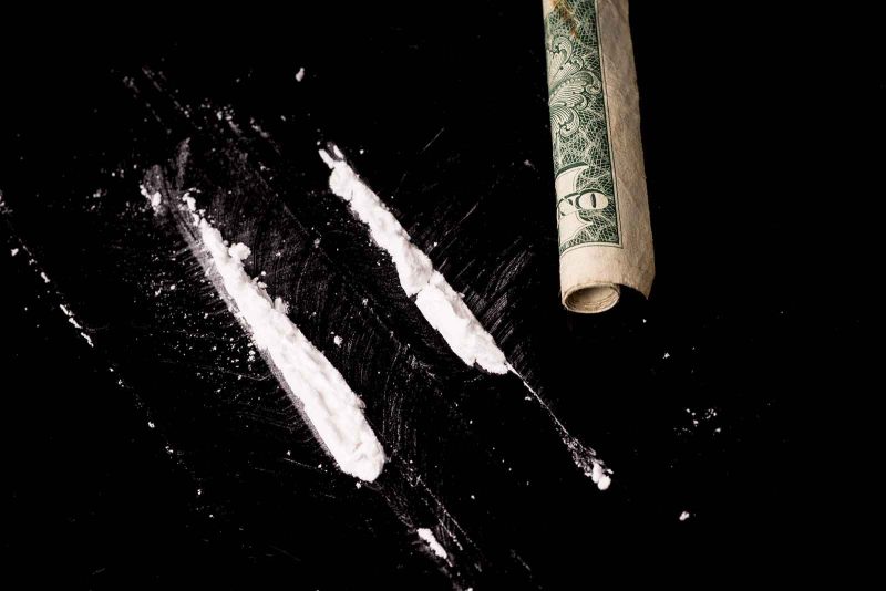 cocaine with rolled dollar bill