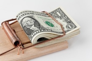 dollar bills in a mouse trap