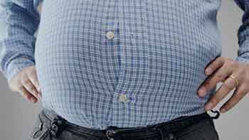 man with big belly with button popped on shirt
